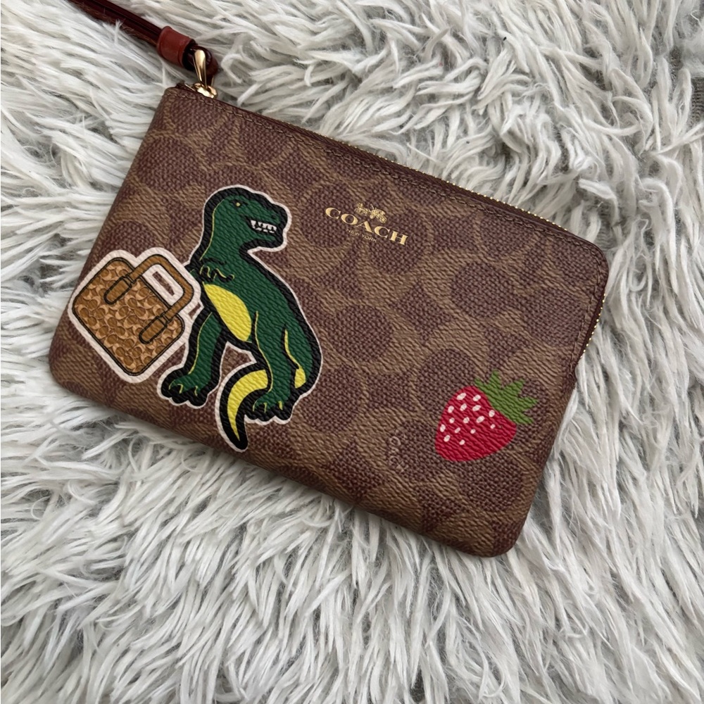 Coach Brown Signature Wristlet with Green Dino & Red Strawberry